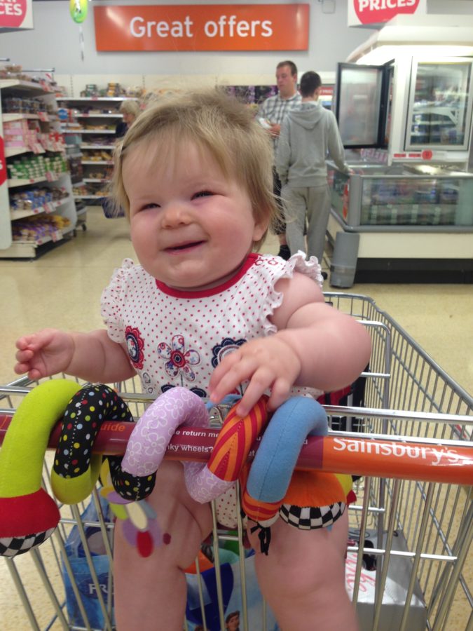 Baby in shopping trolley
