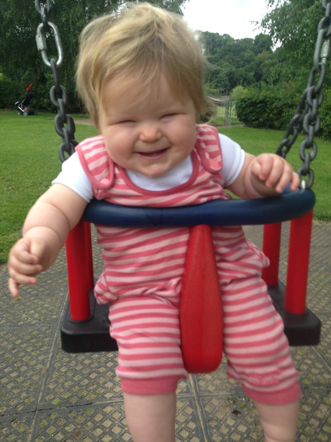 baby girl on swings
