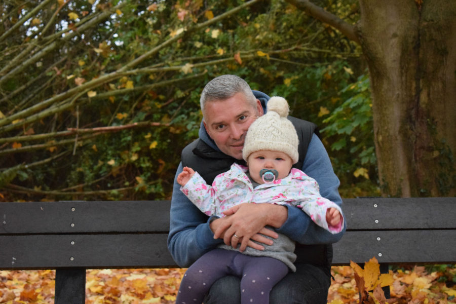 Father and daughter on a bench
