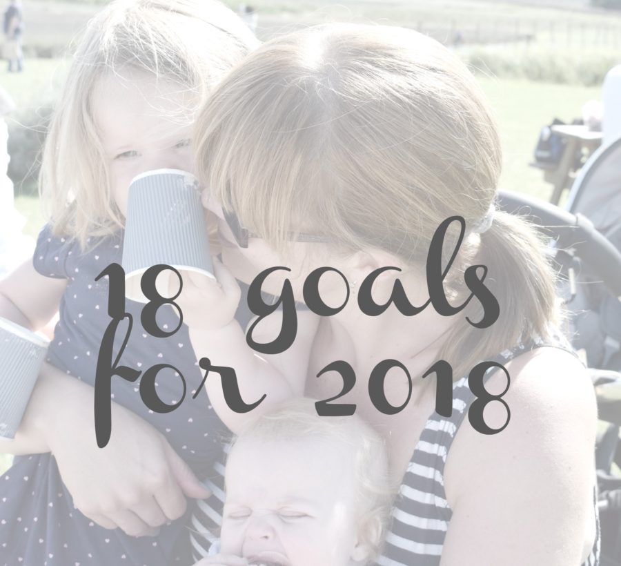 faded photo of mother cuddling two daughters with 18 goals for 2018 written over it