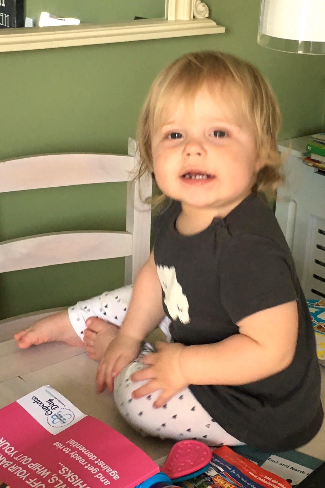 14 months old girl, sitting on dining room table