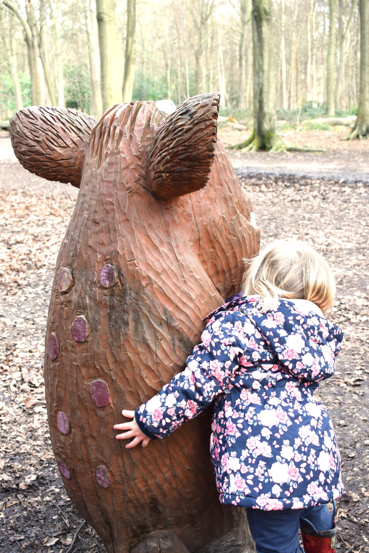 The Gruffalo Trail, Essex, Gruffalo's Child from behind with little girl cuddling it