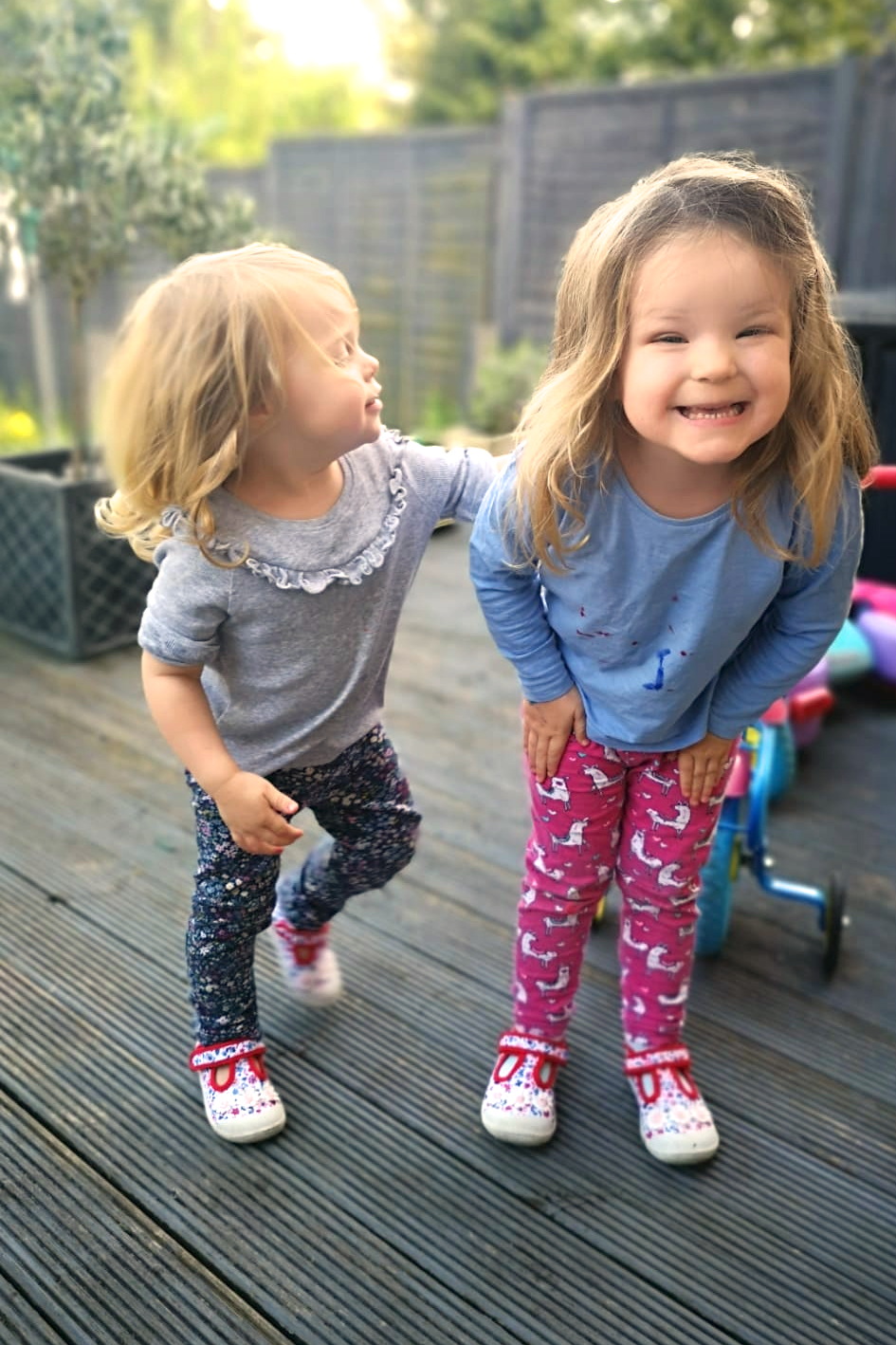 two young sisters playing outside