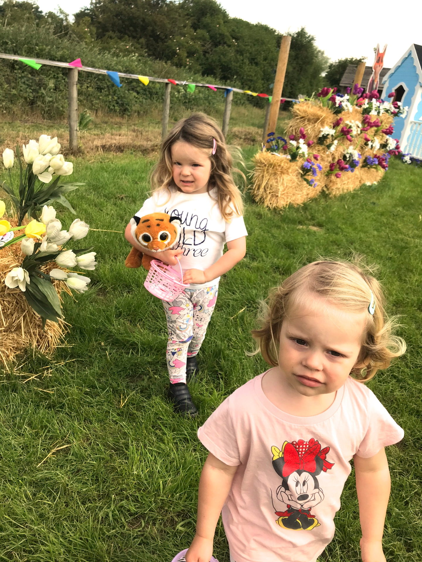 Two sisters on a treasure hunt at Willows Activity Farm, Herts